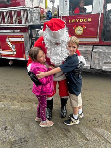 Charlotte and Mason Facey with Santa.