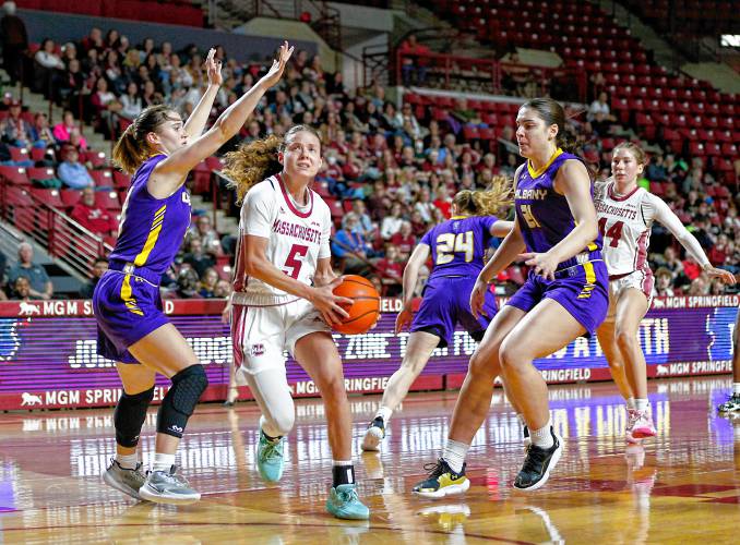 UMass guard Kristin Williams (5) drives to the hoop against UAlbany earlier this season at the Mullins Center in Amherst. UMass guard Kristin Williams (5) drives to the hoop against UAlbany earlier this season at the Mullins Center in Amherst.