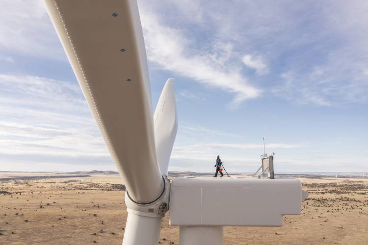 A worker walks atop a wind turbine at the Borderland Wind Project in western New Mexico near the Arizona state line. The BIG WIRES Act would require utilities to more comprehensively tie together various parts of the country’s electrical grid. A worker walks atop a wind turbine at the Borderland Wind Project in western New Mexico near the Arizona state line. The BIG WIRES Act would require utilities to more comprehensively tie together various parts of the country’s electrical grid.