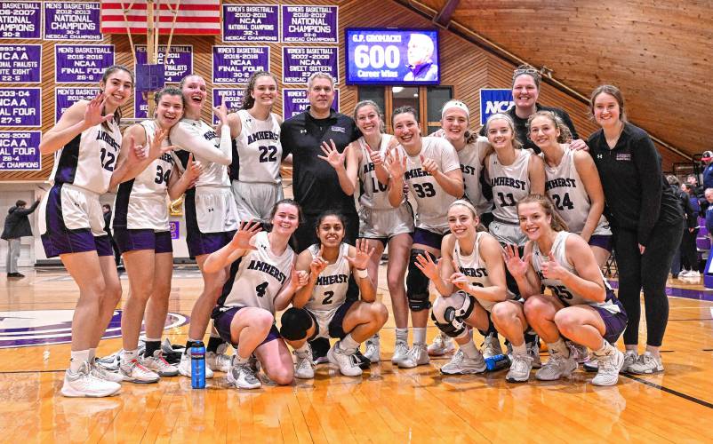 Amherst College women’s basketball coach G.P. Gromacki poses with his team following last week’s win over Connecticut College at LeFrak Gymnasium in Amherst. The victory was No. 600 for Gromacki, who became the fastest coach in NCAA history to reach that mark. Amherst College women’s basketball coach G.P. Gromacki poses with his team following last week’s win over Connecticut College at LeFrak Gymnasium in Amherst. The victory was No. 600 for Gromacki, who became the fastest coach in NCAA history to reach that mark.