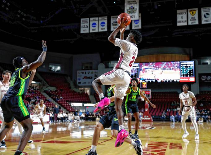 UMass guard Jaylen Curry (2) takes a shot against South Florida earlier this season at the Mullins Center in Amherst. UMass guard Jaylen Curry (2) takes a shot against South Florida earlier this season at the Mullins Center in Amherst.