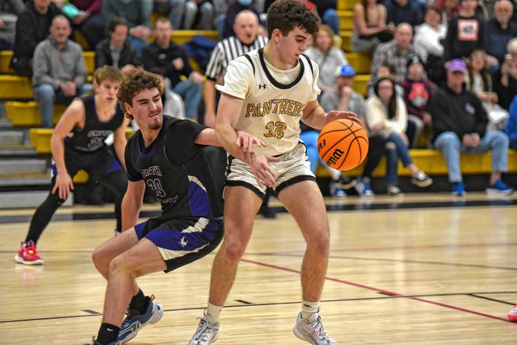 Pioneer’s Josh Wood (32), right, grabs a rebound in front of Smith Academy's Jake Wilcox (2) during the Panthers’ victory in the PVIAC Class D Tournament on Monday night at Messer Gymnasium in Northfield.