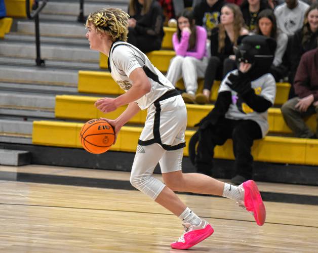 Pioneer’s Jackson Glazier (4) dribbles up the floor against Smith Academy during the Panthers’ victory in the PVIAC Class D Tournament on Monday night at Messer Gymnasium in Northfield.