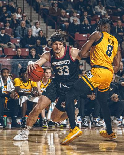 UMass forward Matt Cross (33) drives baseline on VCU’s Michael Belle in the first half of the Minutemen’s game against the Rams on Tuesday night at the Mullins Center. UMass forward Matt Cross (33) drives baseline on VCU’s Michael Belle in the first half of the Minutemen’s game against the Rams on Tuesday night at the Mullins Center.