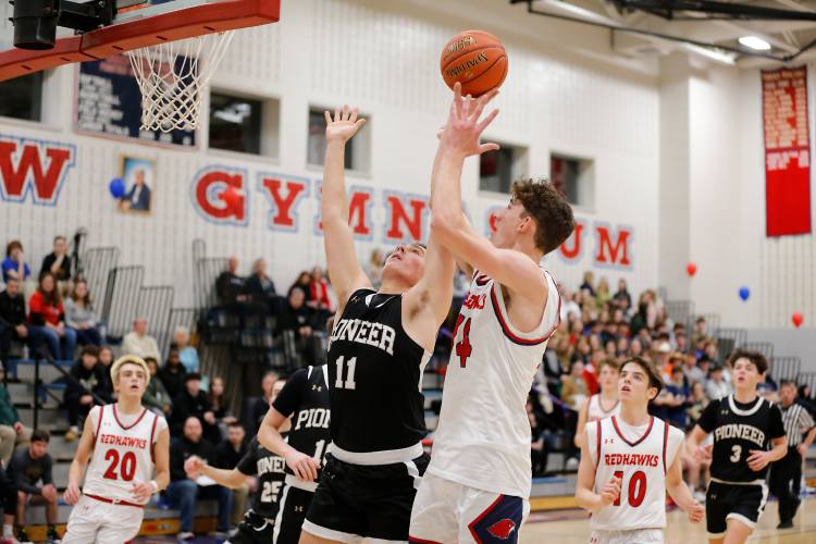 Frontier’s Owen Babb (14) drives to the hoop over Pioneer defender Hugh Cyhowski (11) in the second quarter earlier this season at Goodnow Gymnasium in South Deerfield. Frontier’s Owen Babb (14) drives to the hoop over Pioneer defender Hugh Cyhowski (11) in the second quarter earlier this season at Goodnow Gymnasium in South Deerfield.