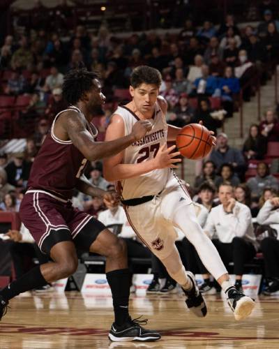 Josh Cohen (23) drives baseline on a Fordham defender during the first half of UMass’ 66-64 win over the Rams on Wednesday night at the Mullins Center. Josh Cohen (23) drives baseline on a Fordham defender during the first half of UMass’ 66-64 win over the Rams on Wednesday night at the Mullins Center.
