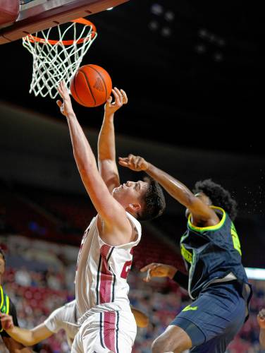 UMass forward Josh Cohen (23) drives to the hoop before being fouled by South Florida’s Gerald Jones (21) in the first half earlier this season at the Mullins Center in Amherst. UMass forward Josh Cohen (23) drives to the hoop before being fouled by South Florida’s Gerald Jones (21) in the first half earlier this season at the Mullins Center in Amherst.