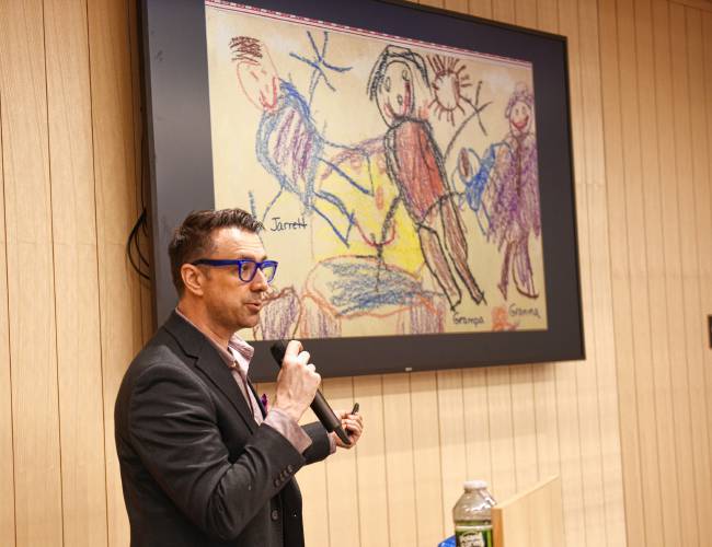 Award-winning author and illustrator Jarrett J. Krosoczka shows some of his childhood art during a talk about his work at the Greenfield Public Library on Tuesday.