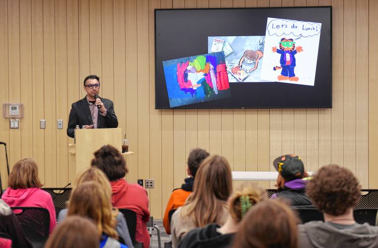 Award-winning author and illustrator Jarrett J. Krosoczka gives a talk about his work at the Greenfield Public Library on Tuesday, with students and members of the public in the audience.