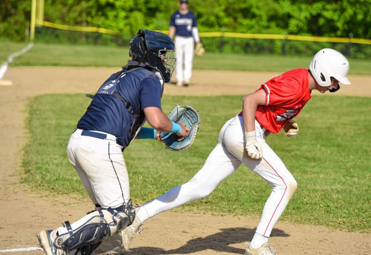 Frontier catcher Kaden James tries to tag out Hampshire’s Vynce Carr after a dropped third strike during the Western Mass. Class B quarterfinal round on Monday at Earl Tonet Field in Westhampton.