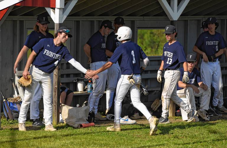 Frontier’s Nico Fasulo (1) is congratulated after scoring a run in the first inning against Hampshire during the Western Mass. Class B quarterfinal round on Monday at Earl Tonet Field in Westhampton.