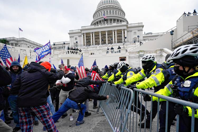 Rioters loyal to President Donald Trump battle police at the U.S. Capitol on Jan. 6, 2021.