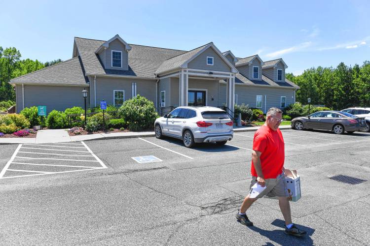 Turners Falls resident Alan Wondoloski leaves the Veterinary Emergency & Specialty Hospital in South Deerfield on Tuesday with his cat Buddy, who had an encounter with a skunk. 