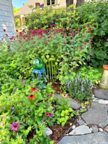Dawn Kennedy and Margo Townley created their patio from stones they found onsite after they purchased their Franklin Street property in Greenfield. Other stones were brought as housewarming gifts from loved ones.