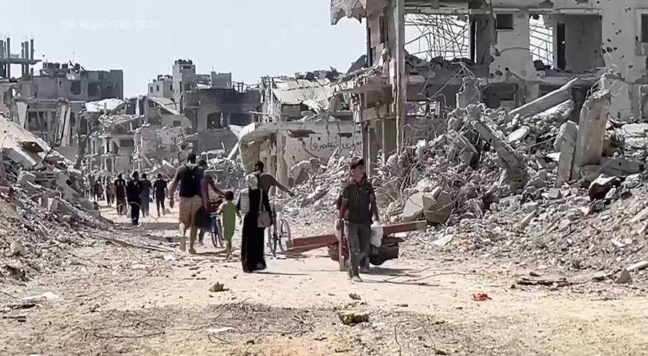 In this image taken from video, Palestinians return to the destruction in Gaza City’s Shijaiyah neighborhood on July 11, after Israeli troops withdrew after an offensive. In this image taken from video, Palestinians return to the destruction in Gaza City’s Shijaiyah neighborhood on July 11, after Israeli troops withdrew after an offensive.