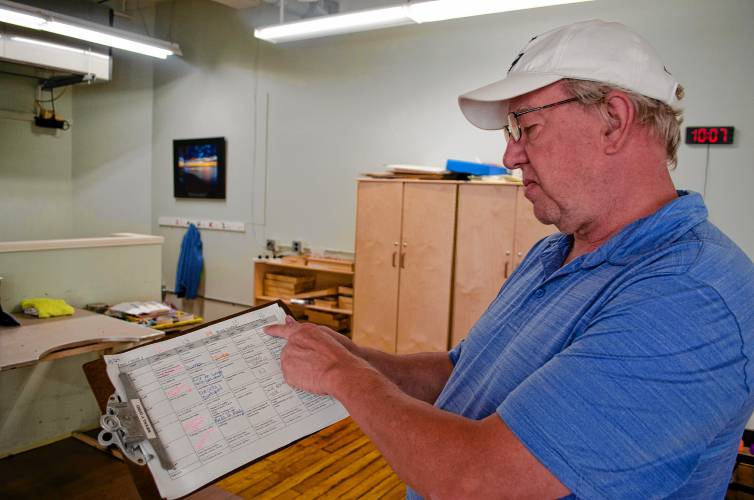 Riverside Industries employee George Joudri shows his weekly schedule during a job fair at the Easthampton nonprofit on Wednesday morning that welcomed Haitian immigrants seeking work. Riverside Industries employee George Joudri shows his weekly schedule during a job fair at the Easthampton nonprofit on Wednesday morning that welcomed Haitian immigrants seeking work.
