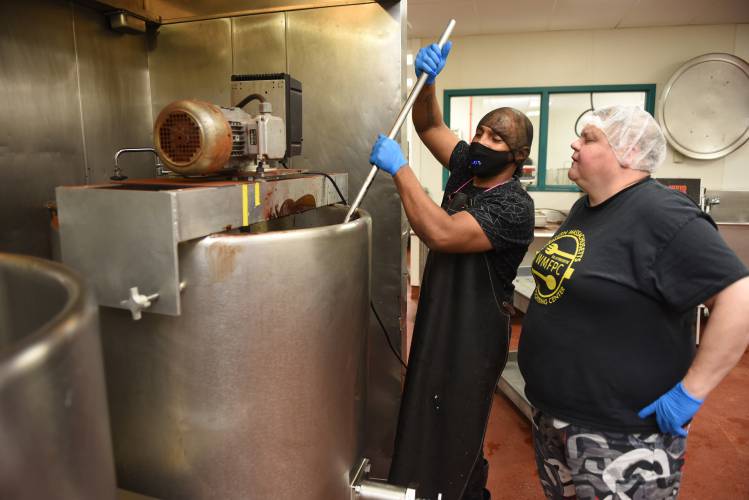 Employee Gigi Gomes and Operations Director Liz Buxton work on a batch of fudge at the Franklin County Community Development Corporation’s Western Massachusetts Food Processing Center on Wells Street in Greenfield in 2022. With help from a $165,000 workforce training grant, Buxton says the Franklin County CDC will continue collaborating with Community Action Pioneer Valley to provide “second-chance employment opportunities for people re-entering the workforce after incarceration.” Employee Gigi Gomes and Operations Director Liz Buxton work on a batch of fudge at the Franklin County Community Development Corporation’s Western Massachusetts Food Processing Center on Wells Street in Greenfield in 2022. With help from a $165,000 workforce training grant, Buxton says the Franklin County CDC will continue collaborating with Community Action Pioneer Valley to provide “second-chance employment opportunities for people re-entering the workforce after incarceration.”
