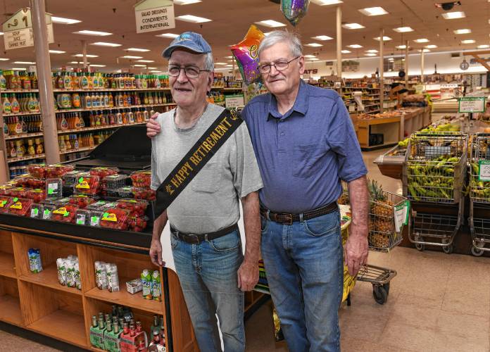 Gary Stevens, who is retiring from Foster’s Supermarket in Greenfield, hangs out with a cardboard cut-out of himself honoring him for his 50 years of employment.