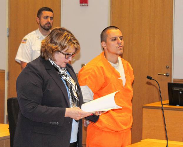 Gabe M. Adams, 21, stands next to defense attorney Nora Leovich before pleading guilty to 14 charges in Franklin County Superior Court on Wednesday afternoon. Gabe M. Adams, 21, stands next to defense attorney Nora Leovich before pleading guilty to 14 charges in Franklin County Superior Court on Wednesday afternoon.