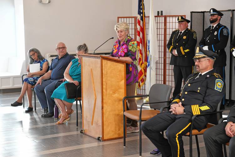 Greenfield Mayor Ginny Desorgher lauds Todd Dodge just before he was sworn in as Greenfield’s permanent police chief at the John Zon Community Center on Tuesday evening.