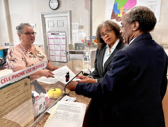 Greenfield residents Joan Marie Jackson and Mitchell Speight hand off a petition, signed by 110 residents, seeking to regulate accessory dwelling unit production in Greenfield at the City Clerk’s Office on Monday. Greenfield residents Joan Marie Jackson and Mitchell Speight hand off a petition, signed by 110 residents, seeking to regulate accessory dwelling unit production in Greenfield at the City Clerk’s Office on Monday.