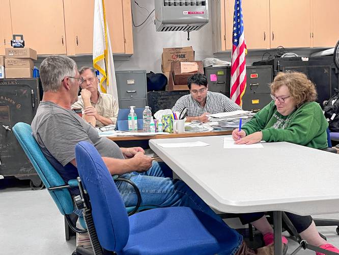 Hawley Selectboard members Bob MacLean, Will Cosby and Hussain Hamdan discuss town clerk needs with Administrative Assistant Tinky Weisblat on Thursday. Hawley Selectboard members Bob MacLean, Will Cosby and Hussain Hamdan discuss town clerk needs with Administrative Assistant Tinky Weisblat on Thursday.