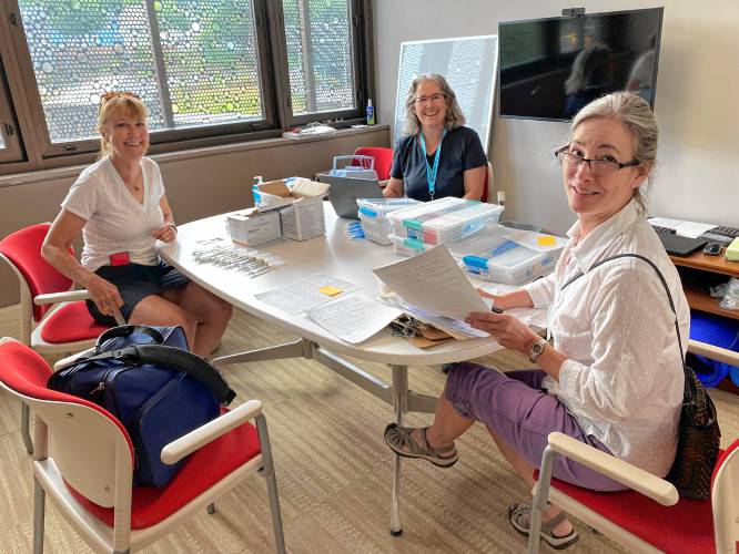Cooperative Public Health Service public health nurses Lisa White (right), Meg Ryan (center) and nurse Jackie Choate (left) prepare to provide home vaccination visits in the fall of 2022. Cooperative Public Health Service public health nurses Lisa White (right), Meg Ryan (center) and nurse Jackie Choate (left) prepare to provide home vaccination visits in the fall of 2022.