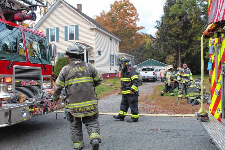 Firefighters respond to a Burrill Avenue home in Orange to extinguish a basement fire on Tuesday. Firefighters respond to a Burrill Avenue home in Orange to extinguish a basement fire on Tuesday.