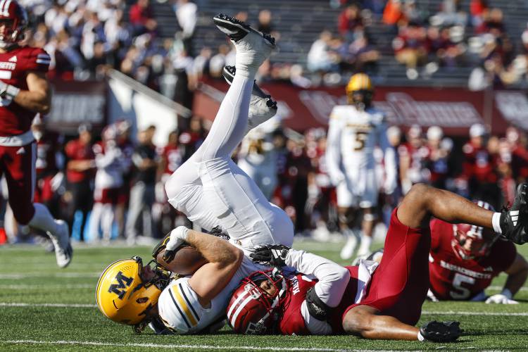 Missouri tight end Brett Norfleet makes a catch and is tackled by Massachusetts linebacker Christian LeBrun in the second half last Saturday in Amherst. Missouri tight end Brett Norfleet makes a catch and is tackled by Massachusetts linebacker Christian LeBrun in the second half last Saturday in Amherst.