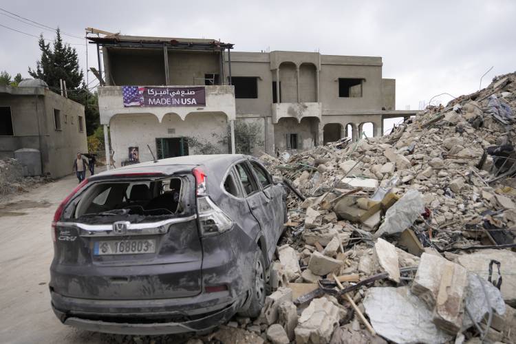 A car sits on the rubble of a building damaged in an Israeli airstrike, in Maisara near the northern coastal town of Byblos, Lebanon, Monday, Oct. 14, 2024. A car sits on the rubble of a building damaged in an Israeli airstrike, in Maisara near the northern coastal town of Byblos, Lebanon, Monday, Oct. 14, 2024.