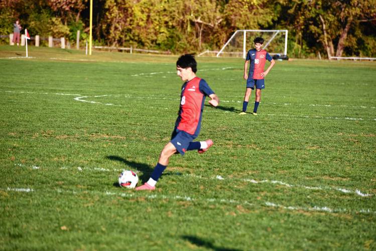 Frontier’s Gus Radner blasts in a free kick from just outside the box against Southwick at Herlihy Park in Whately Friday. 