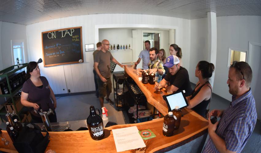 Brick & Feather Brewery on 11th Street in Turners Falls serves beer in the tasting room in 2016. After nine years in business, owner Lawrence George has announced the brewery will be closing by the end of the year. Brick & Feather Brewery on 11th Street in Turners Falls serves beer in the tasting room in 2016. After nine years in business, owner Lawrence George has announced the brewery will be closing by the end of the year.