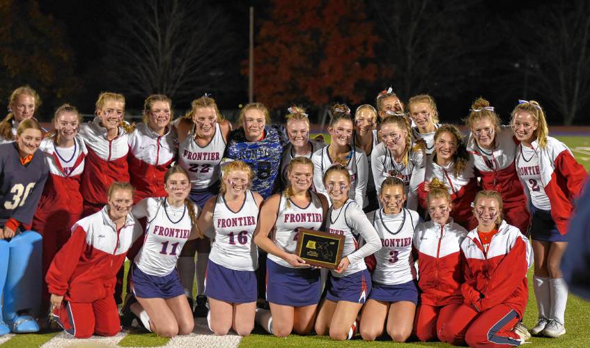 The Frontier field hockey team shows off its new hardware after the Redhawks’ 2-0 victory over Greenfield in the Western Mass. Class C final on Monday night in Holyoke.