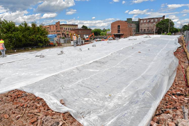 Tarps cover the debris from the June 2022 cereal factory fire in Orange. Tarps cover the debris from the June 2022 cereal factory fire in Orange.