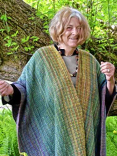 Cynthia Herbert wears one of her hand-knitted shawls.