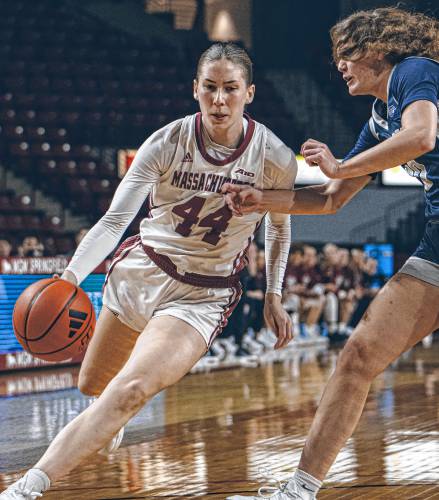 UMass guard Stefanie Kulesza drives to the hoop against New Hampshire’s Sydney Lusher (30) during the first half of the Minutewomen’s 48-45 loss to the Wildcats on Thursday night at Mullins Center in Amherst. UMass guard Stefanie Kulesza drives to the hoop against New Hampshire’s Sydney Lusher (30) during the first half of the Minutewomen’s 48-45 loss to the Wildcats on Thursday night at Mullins Center in Amherst.