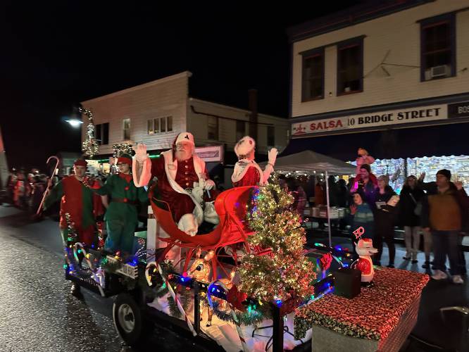 Santa and Mrs. Claus wave to onlookers during the 2022 Moonlight Magic parade through Shelburne Falls. This year the event takes place Nov. 29 from 4 to 9 p.m. Santa and Mrs. Claus wave to onlookers during the 2022 Moonlight Magic parade through Shelburne Falls. This year the event takes place Nov. 29 from 4 to 9 p.m.