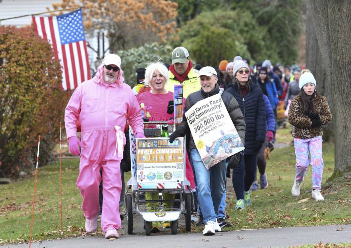 The 14th annual March for the Food Bank with Monte Belmonte, second from left, makes its way up North Main Street in South Deerfield in 2023. This year’s two-day march kicks off Monday and ends Tuesday night. The 14th annual March for the Food Bank with Monte Belmonte, second from left, makes its way up North Main Street in South Deerfield in 2023. This year’s two-day march kicks off Monday and ends Tuesday night.