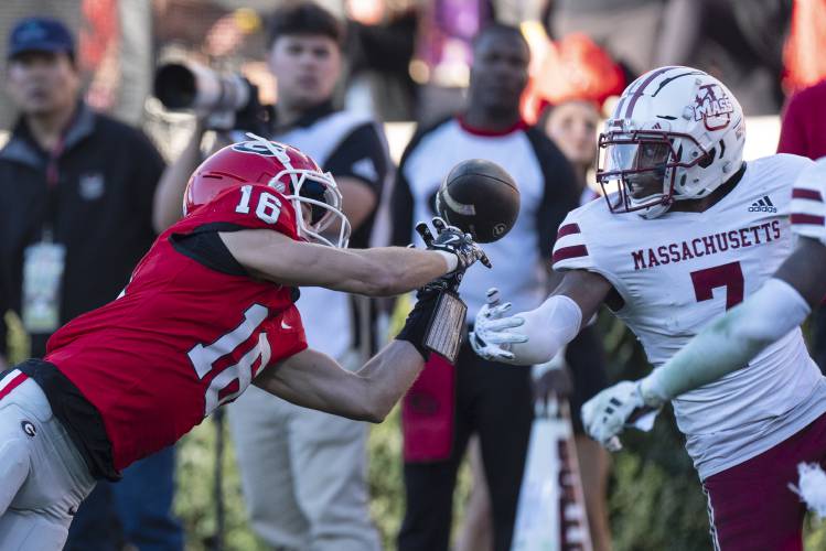 UMass defensive back Lake Ellis (7) breaks up a pass intended for Georgia wide receiver London Humphreys (16) on Saturday in Athens, Ga. UMass defensive back Lake Ellis (7) breaks up a pass intended for Georgia wide receiver London Humphreys (16) on Saturday in Athens, Ga.