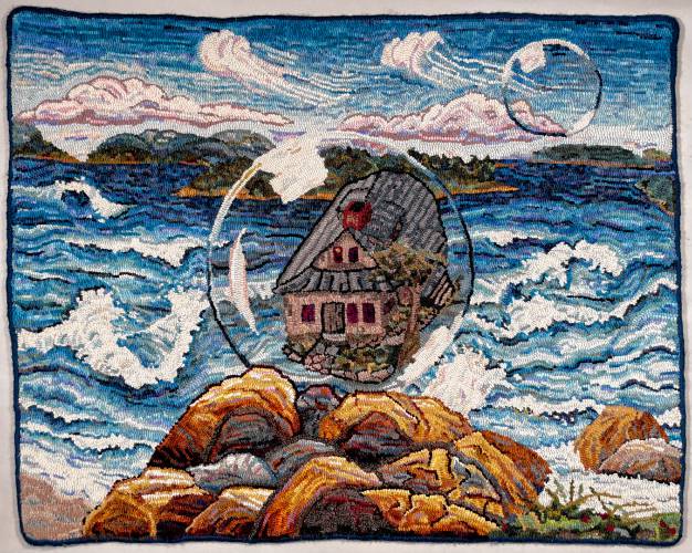Two of Phyllis Lawrence’s favorite places are represented in “Have Bubble, Will Travel.” The home she and her husband, Jim Slavas, built in Wendell over 50 years ago is depicted floating above a Maine seascape. Lawrence will give a rug-hooking demonstration at the Wendell Free Library during her exhibit’s reception from 1 to 3:30 p.m. on Sunday, Dec. 8.