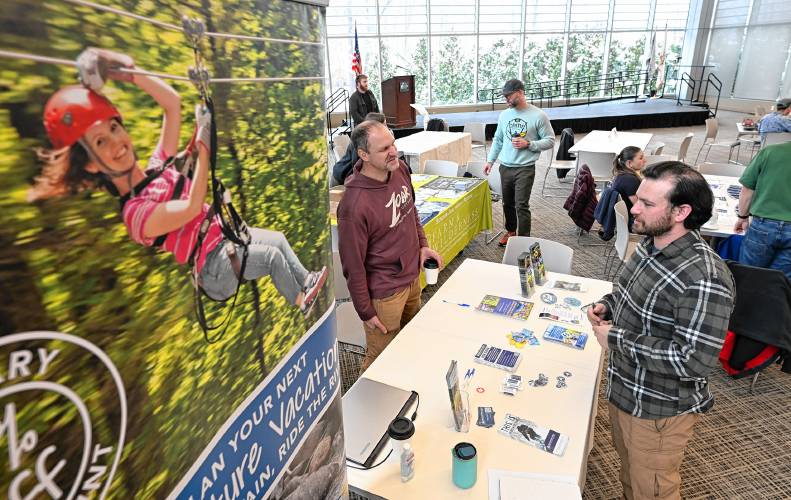 Jim Sullivan, an instructor at Zoar Outdoor, left, talks with Greenfield Community College student Sam Turow during the Outdoor Industry Job Fair at the college on Thursday.
