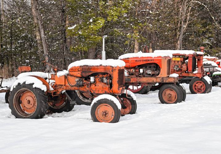 Three tractors are frosted with fresh snow on Barton Road in Greenfield. Three tractors are frosted with fresh snow on Barton Road in Greenfield.